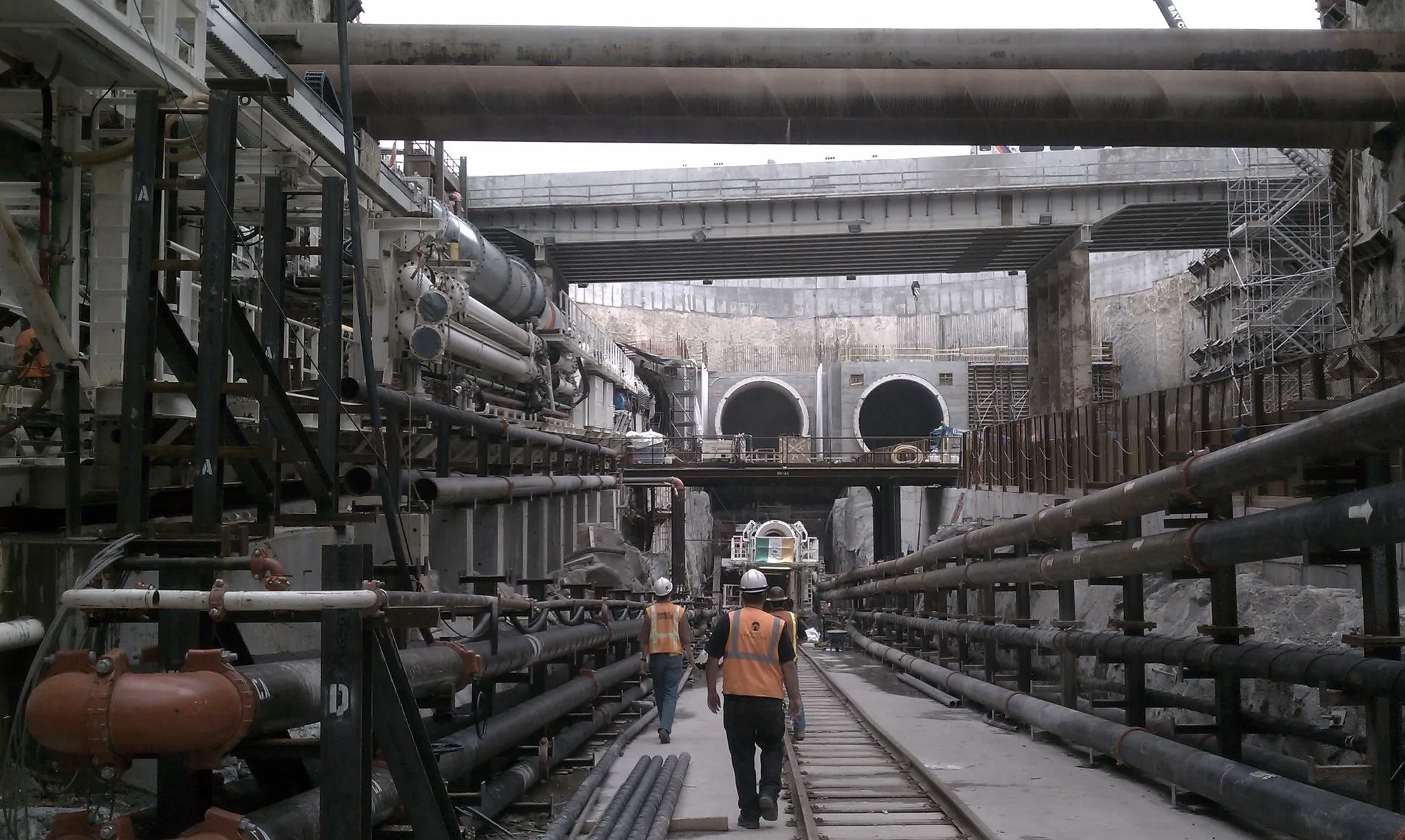 Cut-and-cover excavation with braced support of excavation and monitoring crews